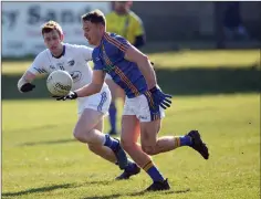  ??  ?? Dean Healy in action against Paul Kingston of Laois.