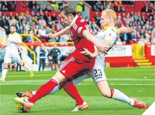  ??  ?? Peter Pawlett is tackled as he is about to square it to Miles Storey.