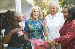  ?? BRIAN INGANGA/AP ?? First lady Jill Biden, center, meets local youths Saturday at a festival in Nairobi, Kenya. Biden will wrap up a five-day visit to Namibia and Kenya on Sunday.