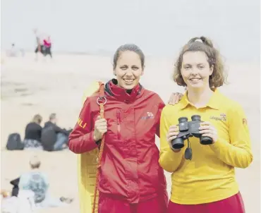  ??  ?? 0 RNLI beach lifeguards Rachael Donald, left, and Tamzin Mcqueenie at Silver Sands in Aberdour