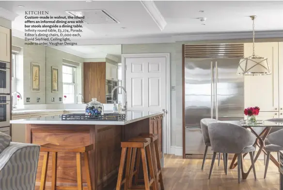  ??  ?? KITCHEN
Custom-made in walnut, the island offers an informal dining area with bar stools alongside a dining table. Infinity round table, £3,274, Porada. Editor’s dining chairs, £1,000 each, David Seyfried. Ceiling light, made to order, Vaughan Designs