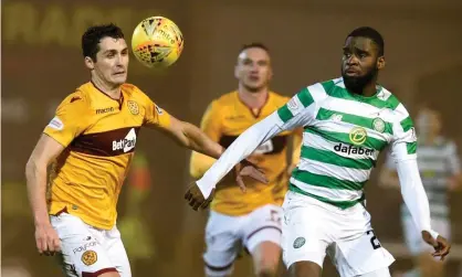  ??  ?? Motherwell’s Carl McHugh (left) and Celtic’s Odsonne Edouard battle for the ball at Fir Park. Photograph: Ian Rutherford/PA