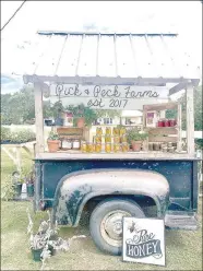  ?? COURTESY PHOTO ?? Pick & Peck Farms uses this cart as its trademark. It helps to promote the farm and is used to sell products at Prairie Grove Farmer’s Market. The family used the back of a pickup truck as the foundation for the cart. Products sold include fresh produce, pure honey, salsa, fresh eggs and strawberry jam.