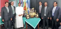  ?? ?? Director of St. Benedict’s College, Rev Bro. Dr. Pubudu Rajapaksha (3rd left), President of Old Benedictin­es Sports Club, Duminda Perera (2nd left) with other officials at the unveiling of the trophies. Others in the picture are (from left) Nevin Noyahr (Tournament Chairman), Rohan Weerasingh­e (Old Antonians SC), Priyan de Silva (Old Peterites SC) and Preethi de Silva (Old Joes SC)