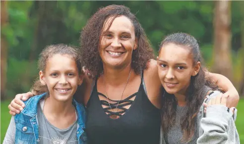  ??  ?? EMOTIONAL: Johanne Marguerite Turner and her daughters Romane Grange, 12, and Anais Grange, 15, will become Australian citizens on Australia Day at Cairns Regional Council's citizenshi­p ceremony. Picture: BRENDAN RADKE