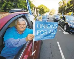  ?? Al Seib Los Angeles Times ?? NEWSOM’S signing of a bill to reclassify up to 1 million contract workers as company employees is seen as a boon to organized labor and to ride-hail drivers.