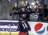  ?? PAUL VERNON - THE ASSOCIATED PRESS ?? Columbus Blue Jackets forward Patrik Laine, top, celebrates his overtime goal against the Seattle Kraken with forward Max Domi in an NHL hockey game in Columbus, Ohio, Saturday.. The Blue Jackets won 2-1.