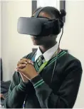  ??  ?? Nonhlanhla Ndhlovu, above, and Esethu Nkabi, below, in their VR goggles.