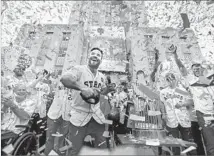  ?? Brett Coomer Houston Chronicle ?? JOSE ALTUVE, center, and his Astros teammates celebrate during a parade honoring the champions in downtown Houston.