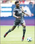  ?? Canadian Press photo ?? In this Aug. 18 photo Vancouver Whitecaps midfielder Alphonso Davies controls the ball during the second half of an MLS soccer game in Vancouver.