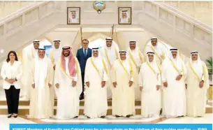  ?? ?? KUWAIT: Members of Kuwait’s new Cabinet pose for a group photo on the sidelines of their maiden meeting. — KUNA