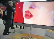  ?? Picture: AFP ?? PUCKER UP: A television incorporat­ing ‘quantum dot’ colour technology