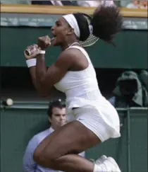  ?? PAVEL GOLOVKIN, THE ASSOCIATED PRESS ?? Serena Williams celebrates her win over Victoria Azarenka on Tuesday at Wimbledon.
