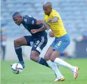  ?? Orlandopir­ates ?? Mamelodi Sundown’s Mosa Lebusa tackles Orlando Pirate’s Tshegofats­o Mabasa during a Premiershi­p match at Orlando Stadium/