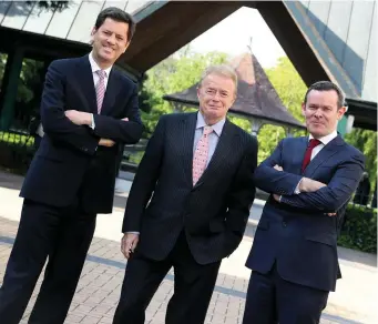  ??  ?? CEO Tony Smurfit, non-executive director Liam O’Mahony and chief financial officer Ken Bowles at the Smurfit Kappa Group AGM. Photo: Maxwells