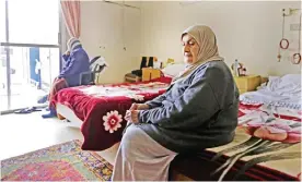  ??  ?? DAMASCUS: Naz Ashiti, a Syrian woman from the rebel-held town of Douma, sits in her room at the Dar al-Saada (Home of Happiness) retirement home, in the Syrian capital Damascus.