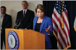  ?? (AP/Steven Senne) ?? Massachuse­tts Attorney General Maura Healey, right, faces reporters as Mass. Gov. Charlie Baker, center, looks on during a news conference in Boston on July 8 to announce the state had dropped its objection to Perdue Pharma’s bankruptcy reorganiza­tion plan.