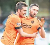  ??  ?? United’s Nicky Clark celebrates his late winner