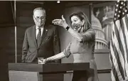  ?? J. Scott Applewhite / Associated Press ?? House Speaker Nancy Pelosi and Senate Minority Leader Chuck Schumer meet with reporters.