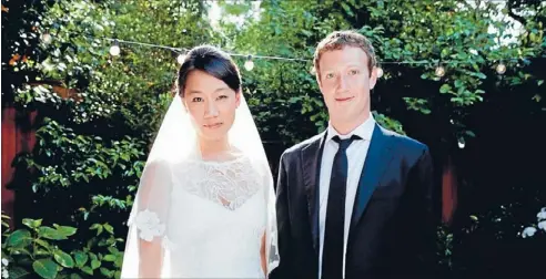  ?? Photo: REUTERS ?? Social network: A photo posted on Facebook shows co-founder and chief executive Mark Zuckerberg and Priscilla Chan at their wedding ceremony in Palo Alto, California, yesterday.