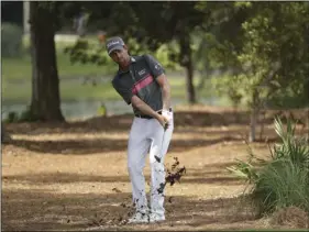  ??  ?? Webb Simpson hits from the second hole fairway, during the third round of the The Players Championsh­ip golf tournament on Saturday, in Ponte Vedra Beach, Fla. AP PHOTO/JOHN RAOUX