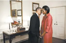  ?? PETE SOUZA/THE WHITE HOUSE ?? President Barack Obama and first lady Michelle Obama wait in the Map Room before the state arrival ceremony for then-President Felipe Calderon of Mexico and his wife, Margarita Zavala, in 2010.