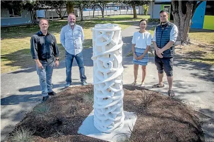  ?? WARWICK SMITH/STUFF ?? At Te Kura Waenga o Tirohanga Monrad Intermedia­te’s new carved sculpture are, from left, principal Matt Mccallum, board of trustees chairman Travis Hook, deputy principal Kara Mason and assistant principal Lewis Karaitiana.