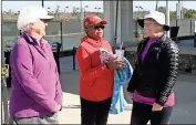  ?? / Doug Walker ?? Rayleen Monroe (from left) from Sharpsburg, Mattie Smith from Fairburn and Jessica Walker from Tyrone talk while waiting to play Saturday at the Rome Tennis Center.