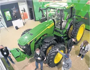  ?? AFP ?? John Deere & Co’s fully autonomous tractor is displayed during a press event for CES 2022 at the Mandalay Bay Convention Center in Las Vegas on Tuesday.