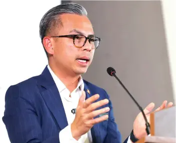  ?? ?? Fahmi said that since the official merger of CelcomDigi at the end of 2022, the telecommun­ication company has completed 30 per cent of the integratio­n process last year, while 40 per cent will be done this year and the remaining 30 per cent by 2025. — Bernama photo