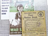  ?? STEVEN SENNE/ASSOCIATED PRESS ?? A World War II British ration card, right, rests on a flyer, center, that shows a woman operating machinery and a family doing yardwork in a display Monday at The Internatio­nal World War II Museum in Natick, Mass. A new exhibit explores the important...