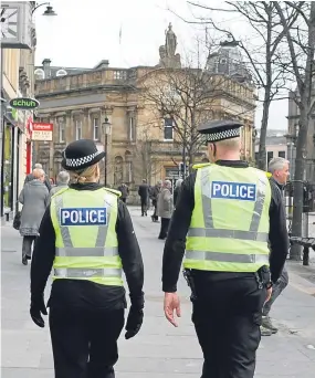  ??  ?? Police on the beat in Dundee city centre.