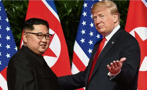  ??  ?? Uneasy calm: The June 2018 summit between Trump and Kim defused an escalatory spiral of threats and ballistic missile tests. US officials hope that a second summit can be scheduled for early 2019. — AFP