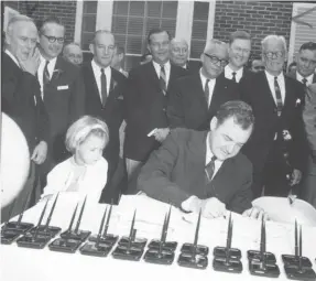  ?? PROVIDED BY U.S. DEPARTMENT OF COMMERCE ?? Then-gov. Claude Kirk signs the bill in 1967 that granted the Disney Corporatio­n the same rights and responsibi­lities as a county government through the Reedy Creek Improvemen­t District.