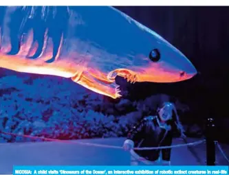  ??  ?? NICOSIA: A child visits ‘Dinosaurs of the Ocean’, an interactiv­e exhibition of robotic extinct creatures in real-life size, in the Cypriot capital yesterday. — AFP