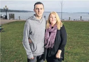  ?? RYAN TAPLIN/SALTWIRE NETWORK ?? Curtis Coley and his mom Wendy pose for a photo in Bedford’s Dewolf Park on Wednesday afternoon. Curtis was involved in a near-fatal car accident almost a year ago.