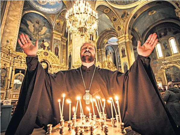  ?? ?? Father Dimitryi, the archpriest of the Holy Assumption Cathedral in Odesa, blames Ukraine’s leaders and the West for forcing Russia to invade. ‘Why do you need to bother a sleeping bear? They were provoking,’ he said
