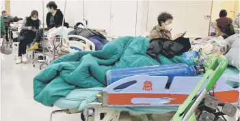  ?? — AFP photo ?? Photo shows Covid-19 patients on beds at Tianjin Nankai Hospital in Tianjin, China.
