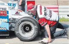  ??  ?? Merrittvil­le Speedway head tech inspector Mark Chapman gives Noah Namo's Sportsman race car a close look at the first practice of the 2020 season at the Thorold track.