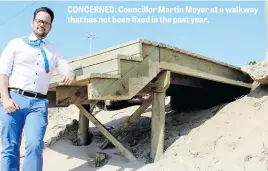  ??  ?? CONCERNED: Councillor Martin Meyer at a walkway that has not been fixed in the past year.