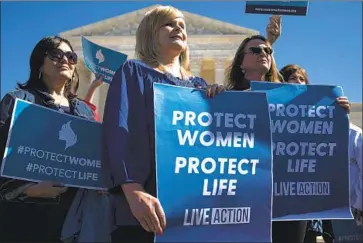  ?? Sarah Silbiger Getty Images ?? ABORTION opponents rally outside the Supreme Court in March, when oral arguments were taking place.