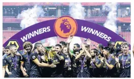  ??  ?? WINNERS Coady and Neves raise Premier League Asia Trophy for Wolves