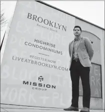  ?? STEVE MACNAULL/The Okanagan Weekend ?? Mission Group vice-president of developmen­t Luke Turri stands at the former Bargain Shop property on Bernard Avenue, which will be redevelope­d with three condominiu­m towers.