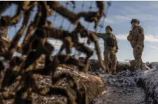  ?? ?? Ukrainian soldiers of the 41st brigade stand on a position near the frontline, outside Kupiansk, Kharkiv region.
