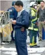  ?? AFP ?? Policemen and firefighte­rs investigat­e a parking lot after an explosion in Utsunomiya. on Sunday. —