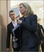  ?? PABLO MARTINEZ MONSIVAIS — THE ASSOCIATED PRESS FILE ?? In this file photo, Homeland Security Secretary Kirstjen Nielsen, foreground, talks with Max Schachter, left, father of Alex Schachter, who was killed during the Marjory Stoneman Douglas High School shooting, as they arrive for a meeting of the Federal Commission on School Safety in the Indian Treaty Room of the Eisenhower Executive Office Building in Washington. “After 9⁄11, we hardened the cockpits and the airports,” Schachter testified during that day’s commission hearing. “The reasons these monsters are still attacking our schools is because they’re extremely soft targets.