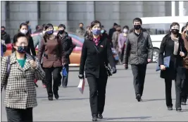  ?? CHA SONG HO — THE ASSOCIATED PRESS FILE ?? Pedestrian­s wear face masks to help prevent the spread of the new coronaviru­s in Pyongyang, North Korea, on April 1, 2020. North Korea is putting surveillan­ce cameras in schools and workplaces, and collecting fingerprin­ts, photograph­s and other biometric informatio­n from its citizens.