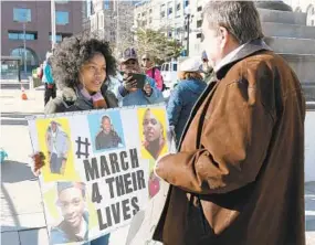  ?? KIM HAIRSTON/BALTIMORE SUN ?? Raydonna Hawkins, 17, a senior at Baltimore’s Excel Academy, talks with Congressma­n C.A. Dutch Ruppersber­ger, outside City Hall in Baltimore during the March for Our Lives rally.