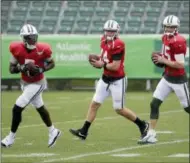  ?? SETH WENIG - THE ASSOCIATED PRESS ?? New York Jets quarterbac­ks Teddy Bridgewate­r, left, Sam Darnold, center, and Josh McCown participat­e in a practice at the NFL football team’s training camp in Florham Park, N.J., Monday, July 30, 2018.