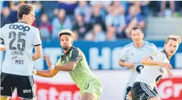  ?? AP. Pictures: ?? Odsonne Edouard, top, challenges Rosenborg’s Marius Lundemo; above: Scott Sinclair clears from Vegar Eggen Hedenstad.